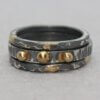 Stapelringen in gezwart zilver met 14ct goud