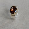 Zilveren ring met rookkwarts in gouden kast