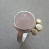 Zilveren ring met rozenkwarts en geelgouden details