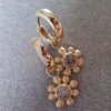 Gouden creoolhangers met paarsbruine fancy diamant